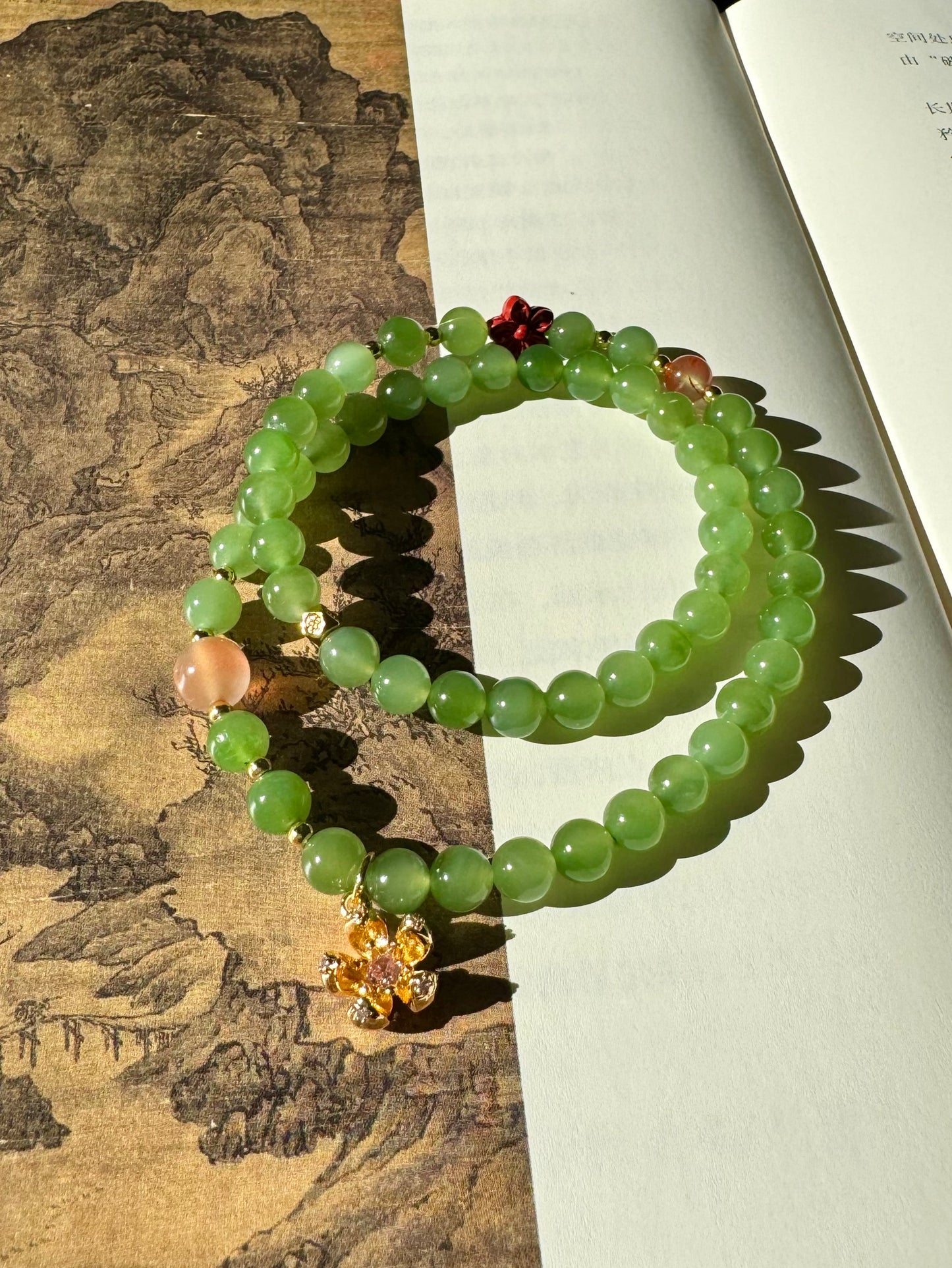 Natural Apple Green Nephrite Beaded Bracelet with a sakura charm