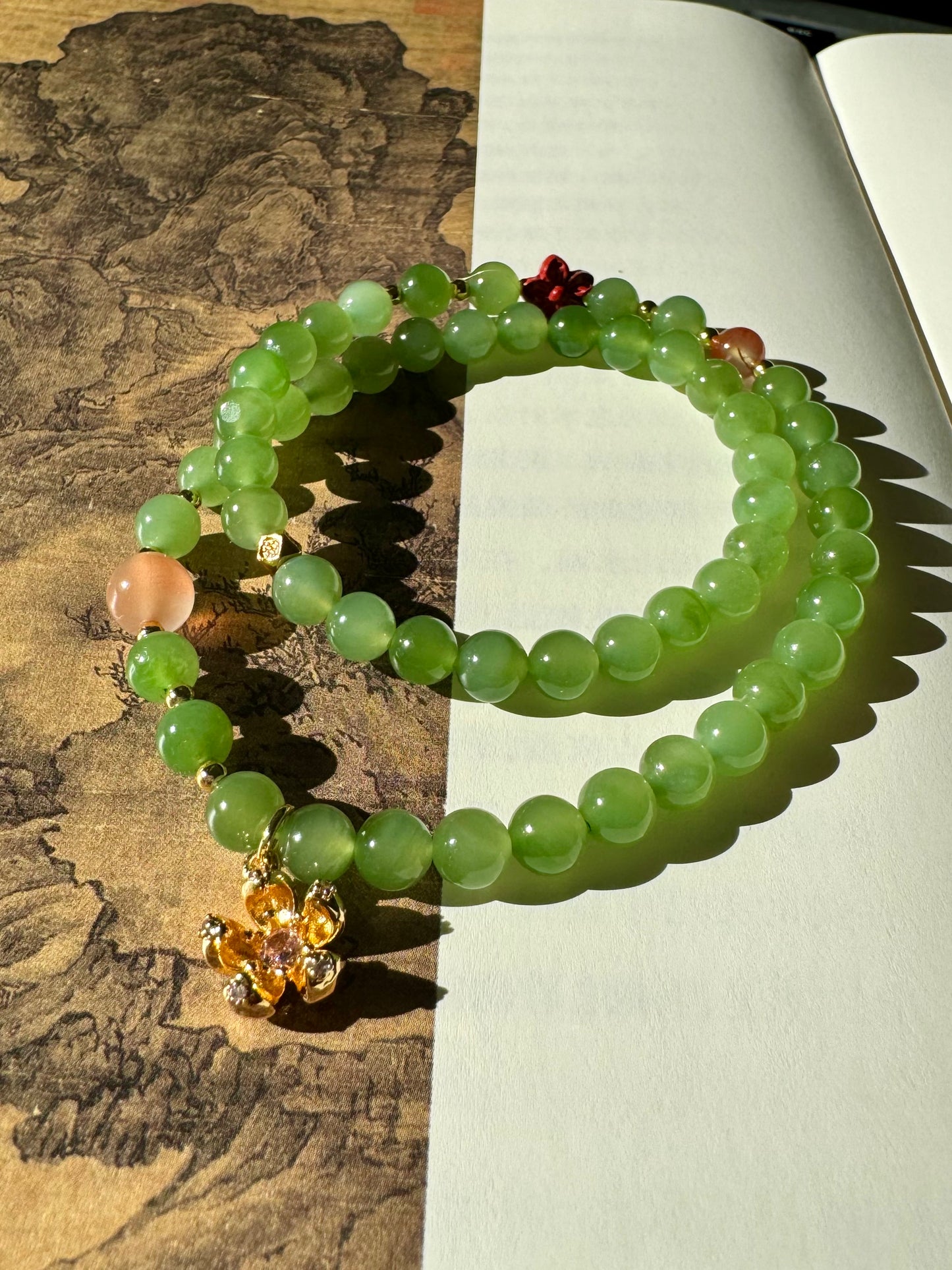 Natural Apple Green Nephrite Beaded Bracelet with a sakura charm